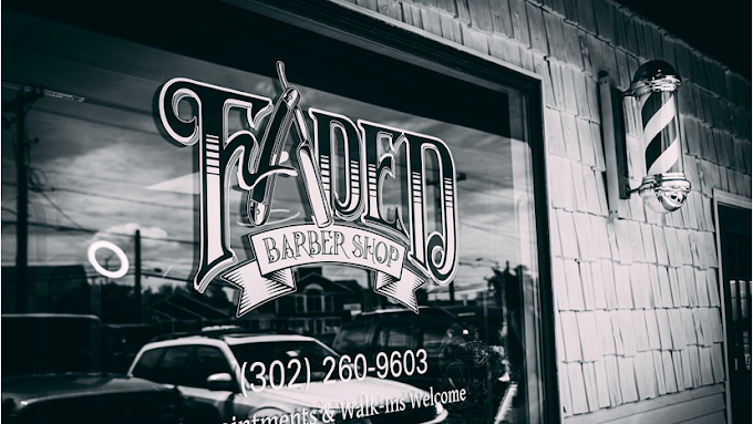 Faded Barber Shop hand-lettered window sign in Rehoboth Beach