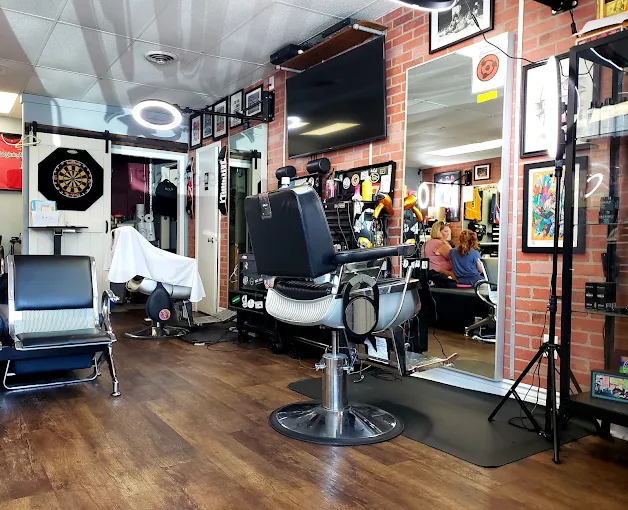 Interior of Faded Barber Shop with brick walls and barber chairs