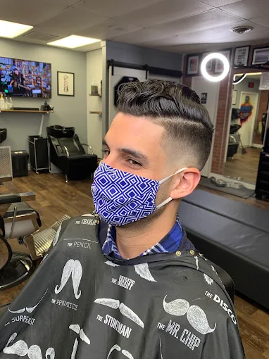 Client with a fresh skin fade and textured top at Faded Barber Shop
